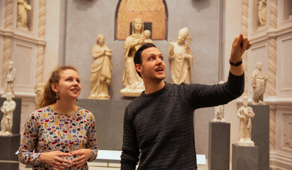 A local guide given a private tour in the Uffizi for a tourist in Florence