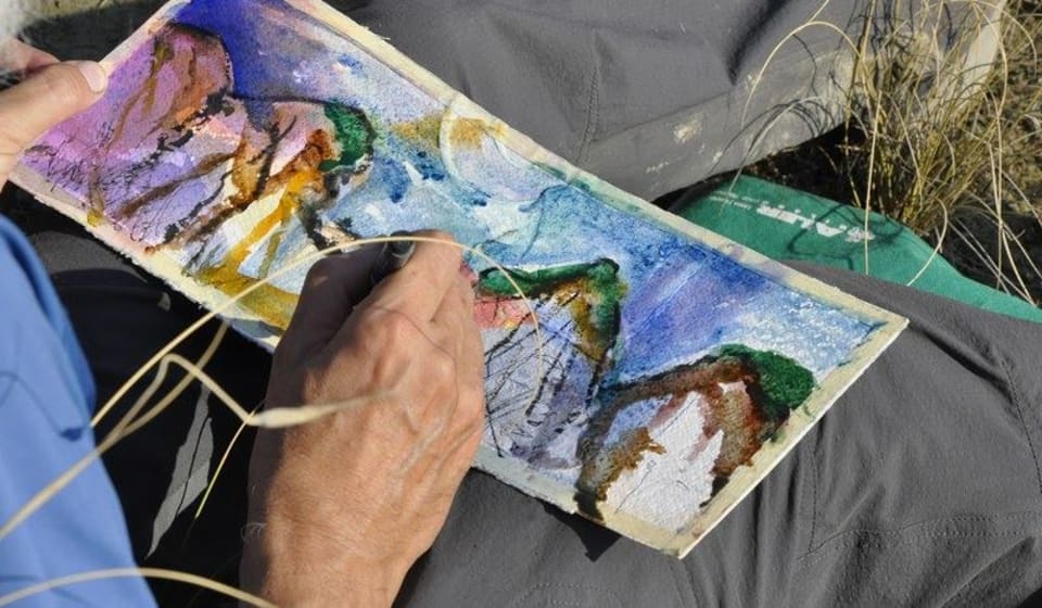 A watercolor painting on a man's lab
