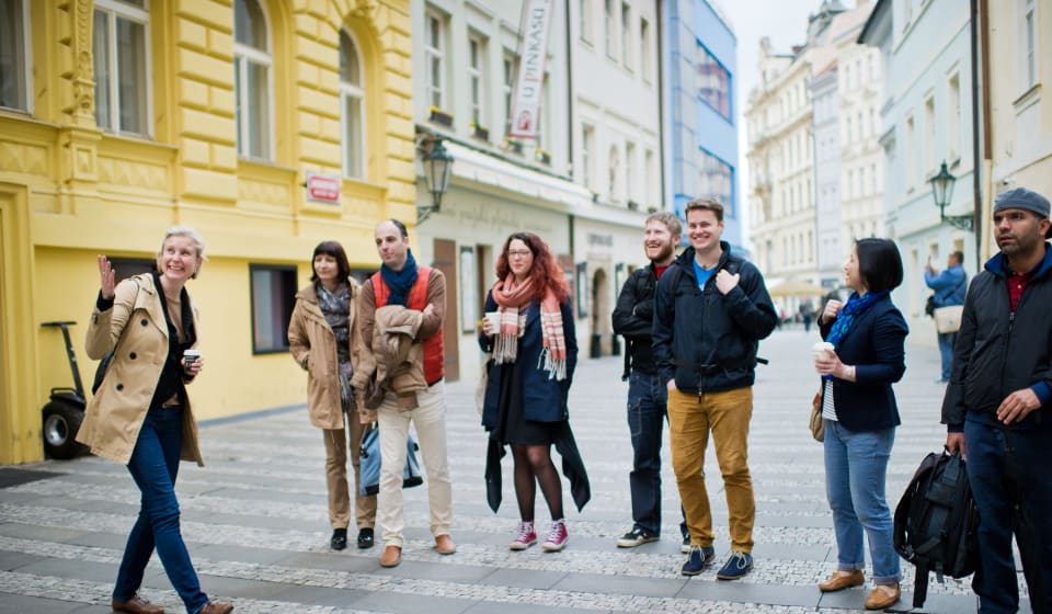 Local guide telling a story to a group of tourists