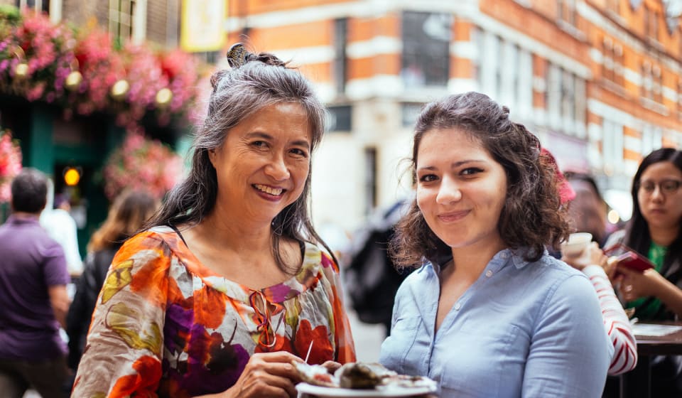 A local and a tourist sharing a meal in London