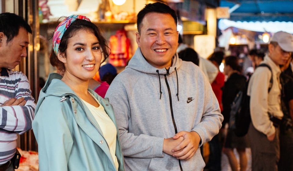 A local guide and a tourists in Jiufen Old street in Taiwan.