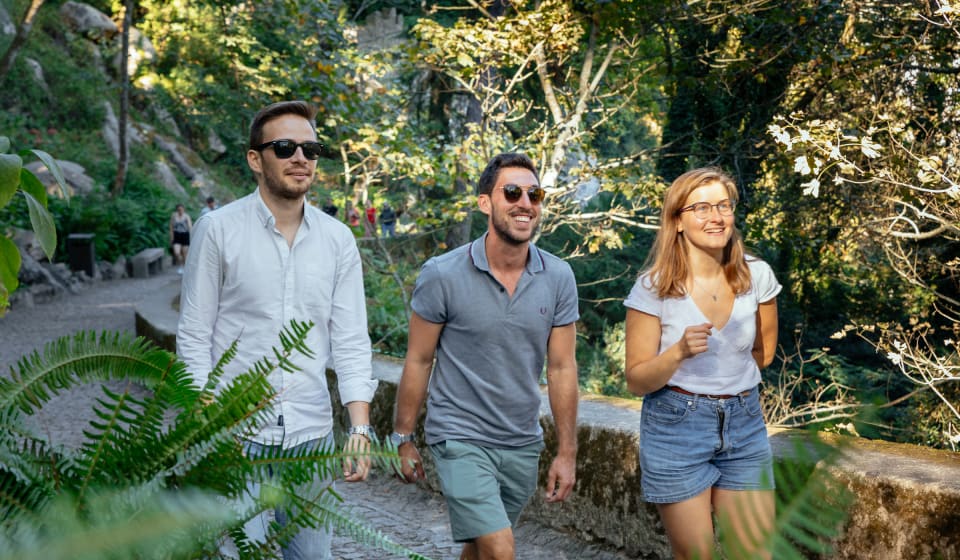 A local guide with tourists walking around in Sintra