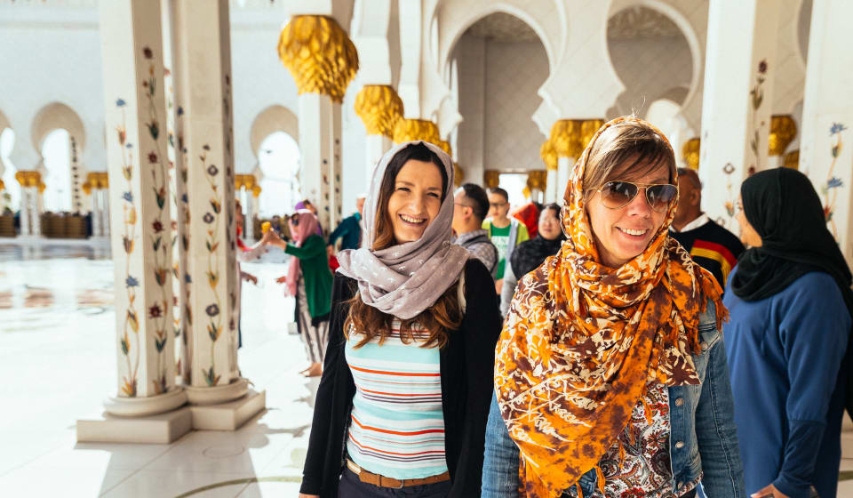 Two girls smiling at the camera in The White Fort, Abu Dhabi