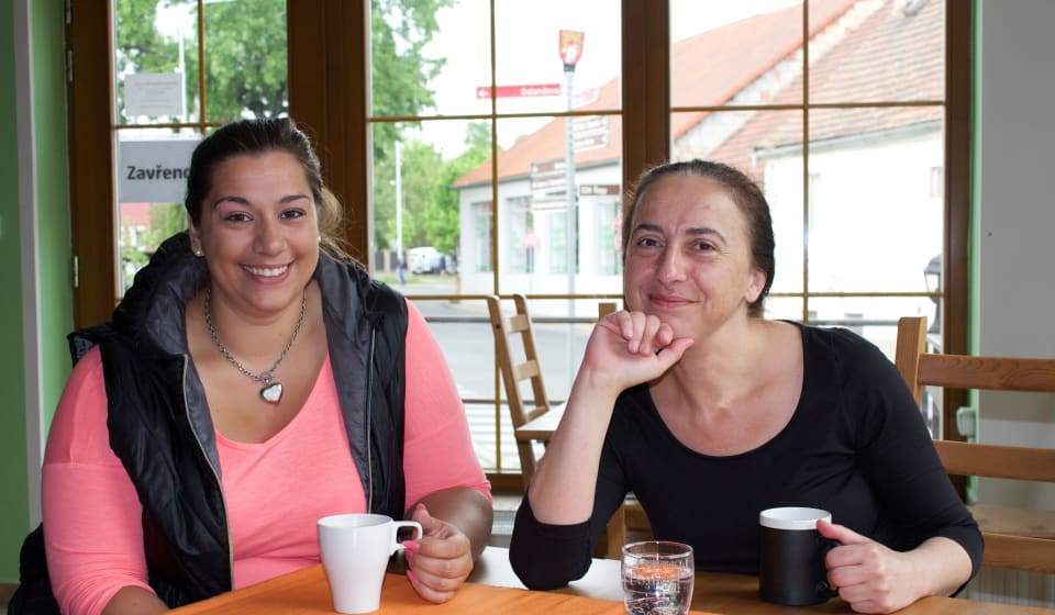 Two ladies drinking coffee
