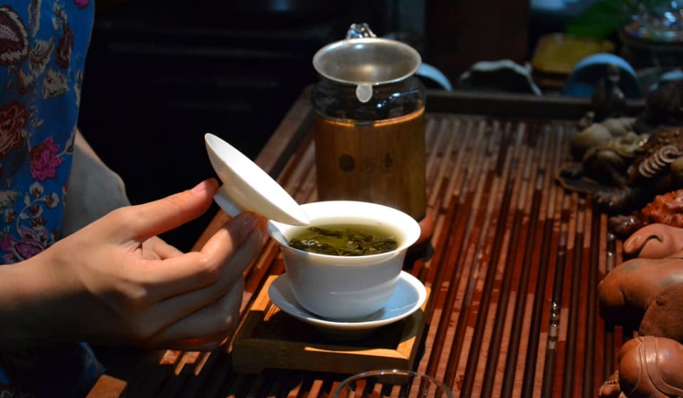 A local guide showing fresh made Taiwanese tea