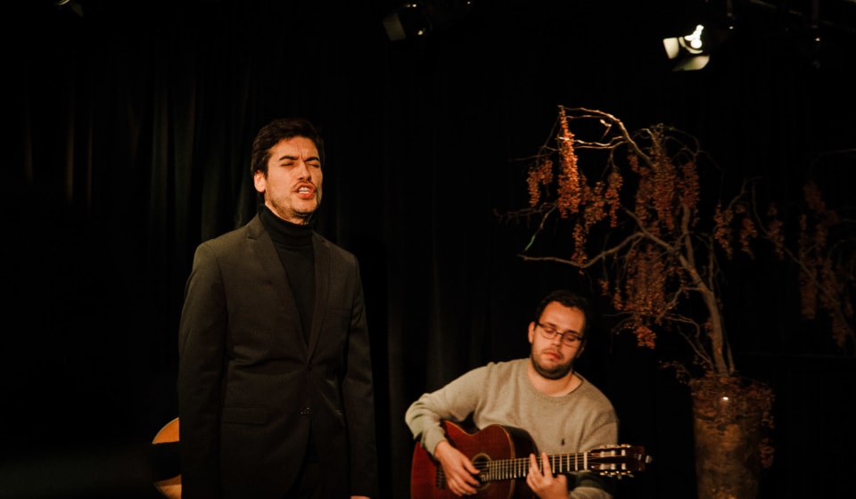 A Fado singer and a guitar player in a bar in Lisbon