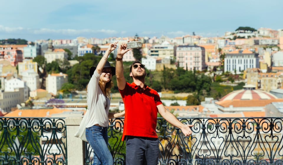 Two tourists taking a selfie at the Miradouros viewpoint