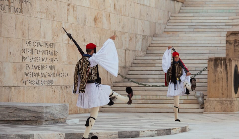 Greek guards standing watch at the Tomb of the unknown soldier in Athens