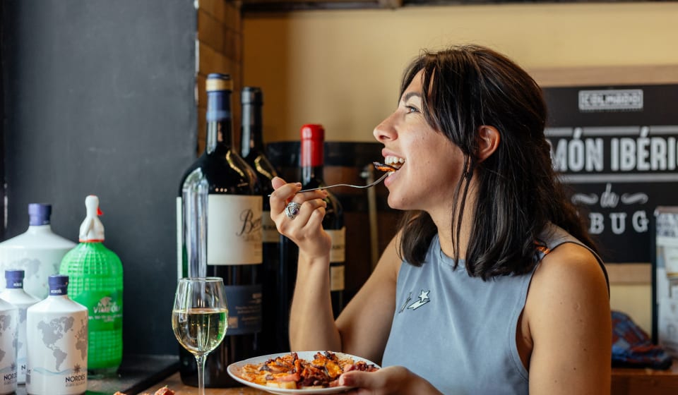 A local enjoying tapas and wine in Barcelona