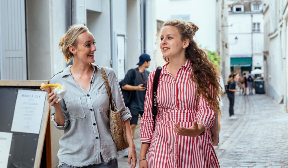 A local guide and tourist wandering in Montmartre