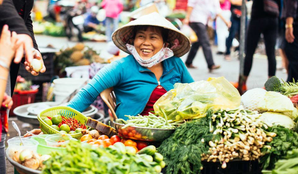 A local vendor on the market of Ho Chi Minh city selling local produce