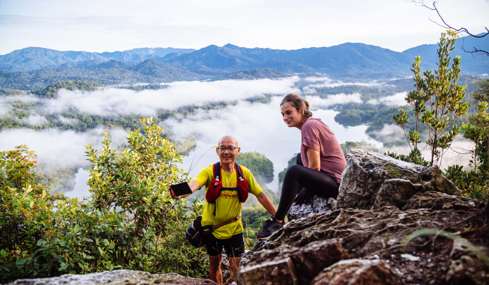 Two people on top of a mountain
