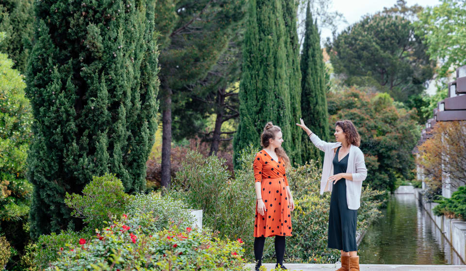 A local guide showing a tourist a park in Lisbon