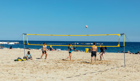 A group of people playing beach volley on St. kilda Beach