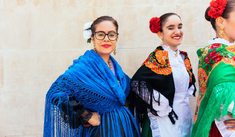 Three spanish ladies dressed traditionally for Flamenco in Madrid