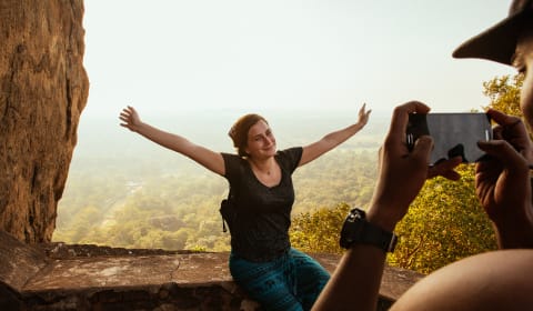 A tourist posing for a picture in Sri Lankan nature