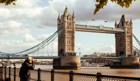 A view on the London Tower Bridge at a river bank of the Thames in London