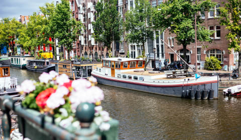 A view on the canal and boats in Amsterdam