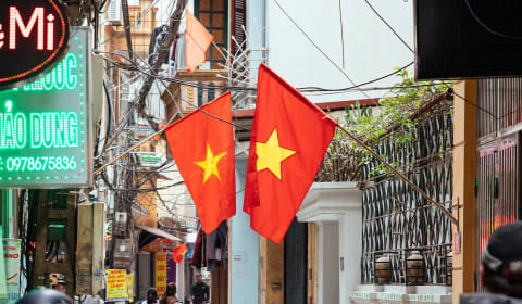 Two vietnamese flags in a street of Hanoi