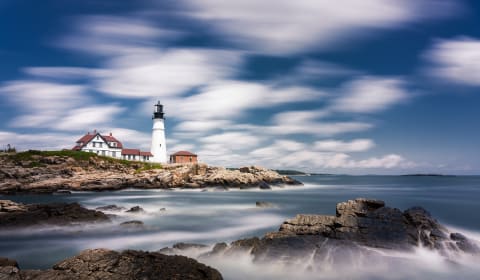 A view on the coast with a lighthouse at Portland, Maine