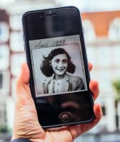 An image of Anne Frank on a phone