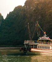 A boat cruising in Halong Bay